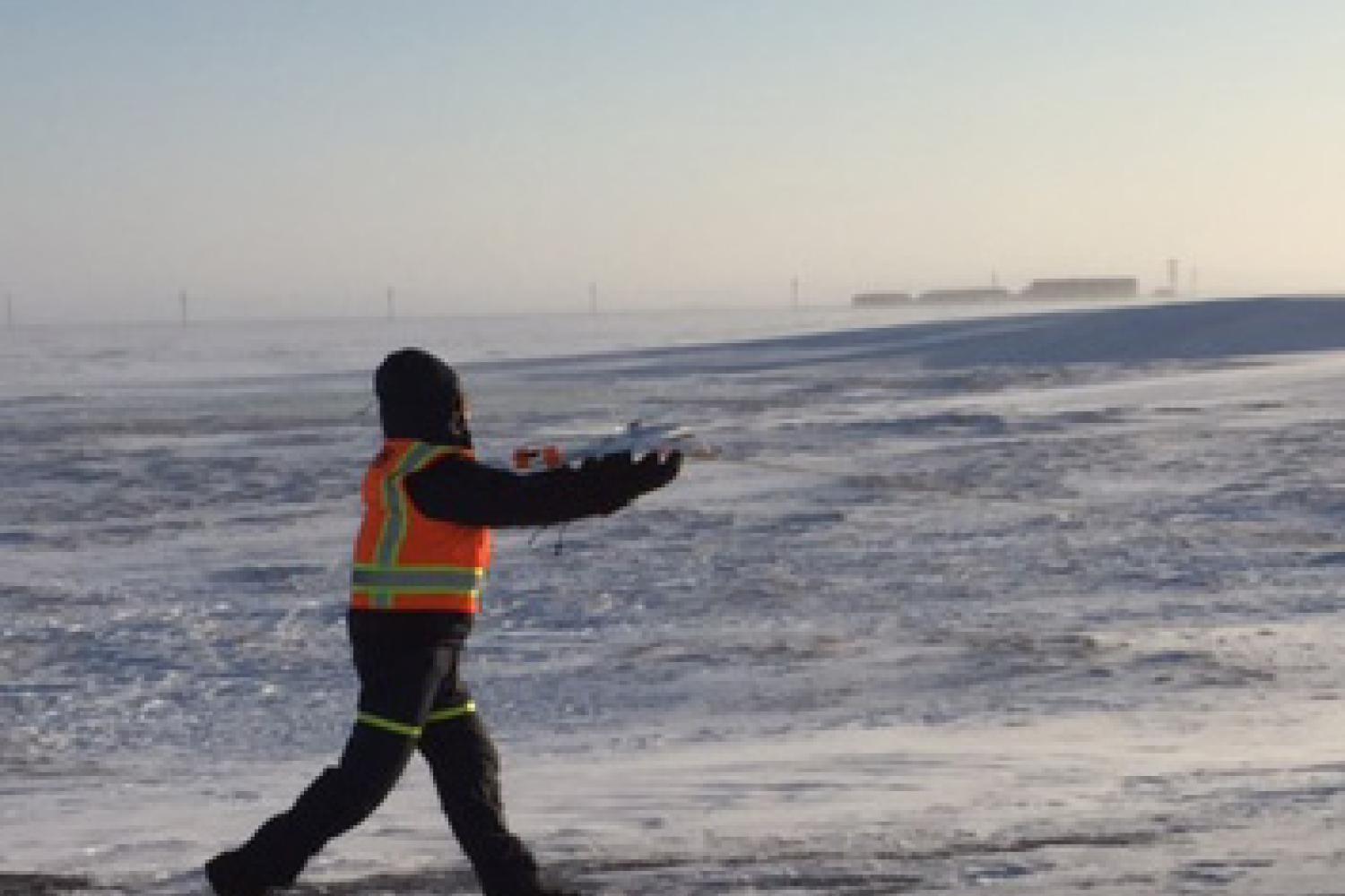 Gijs de Boer flying an unmanned aircraft in Alaska.