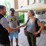 Photo of people shaking hands on-campus