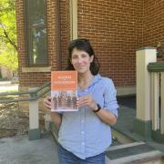 Kalisman holding copy of her book
