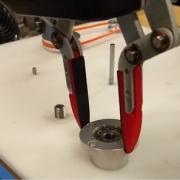Robot performing peg-in-hole insertion of a tight bearing