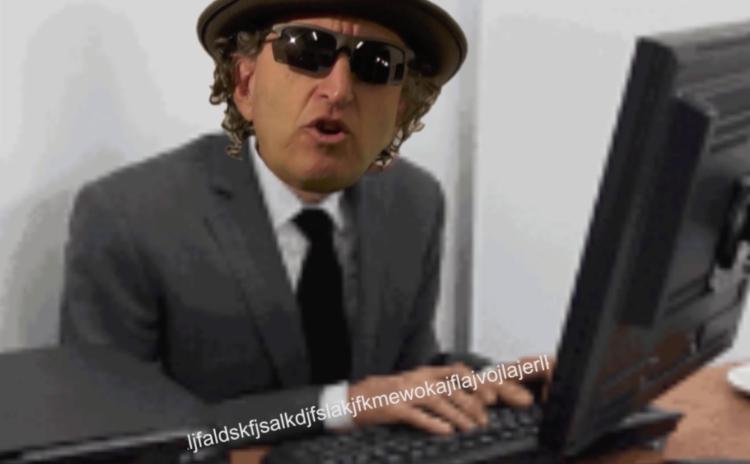 Mark Amerika sitting at a computer typing with random letters overlaid on the top of the image.