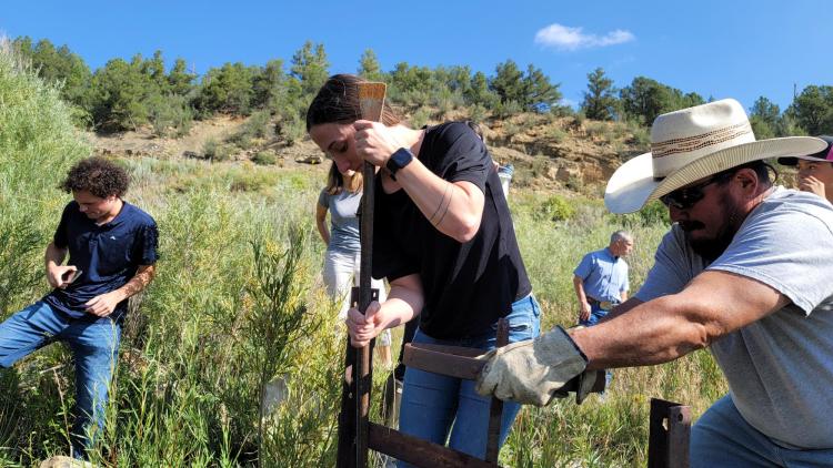 Acequia Project students working in the outdoors