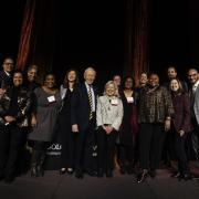 The Law Alumni Board on stage with the Dean and Georgette Vigil
