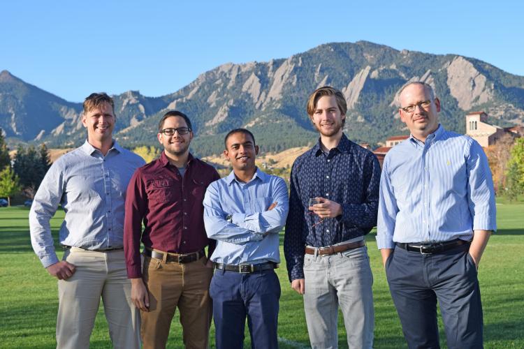 Victor Bright with his researchers in front of the Boulder Flatiron mountains.