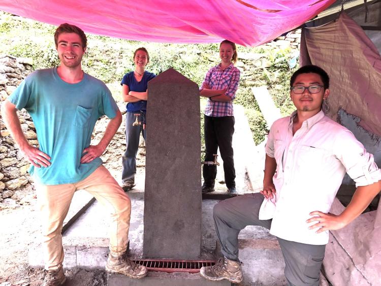 Emily and the CU EWB Nepal Team pose with the completed tapstand at the Balodaya Secondary School.