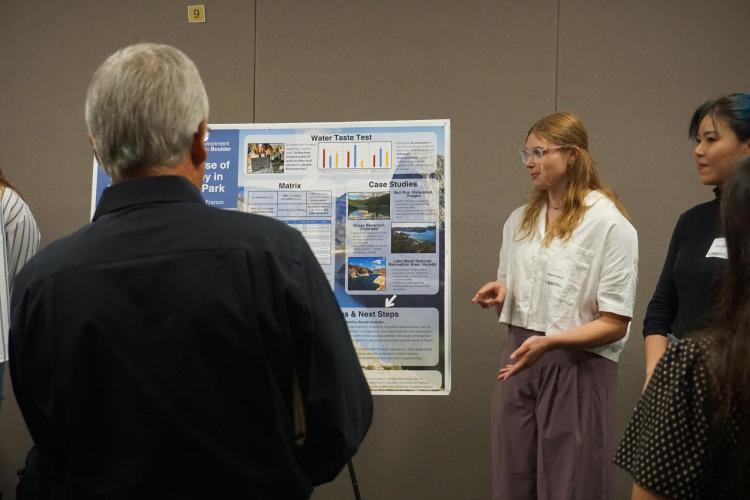 Student group presenting at Capstone Poster Session.