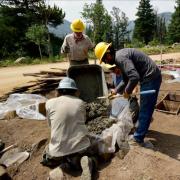 Workers prepare concrete outside