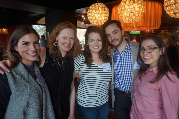 alumni posing at happy hour