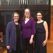 erika eckert, margaret mcdonald, abigail nims posing by organ