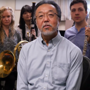 yoshi and a group of students sitting in his office