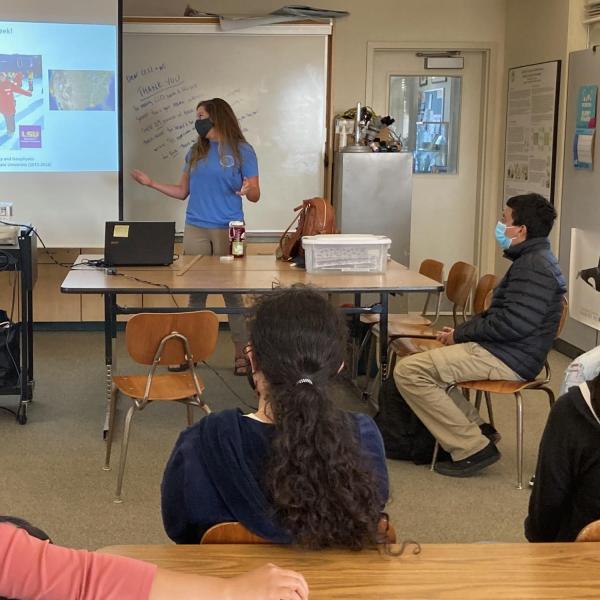 krista myers talking to students in a classroom 