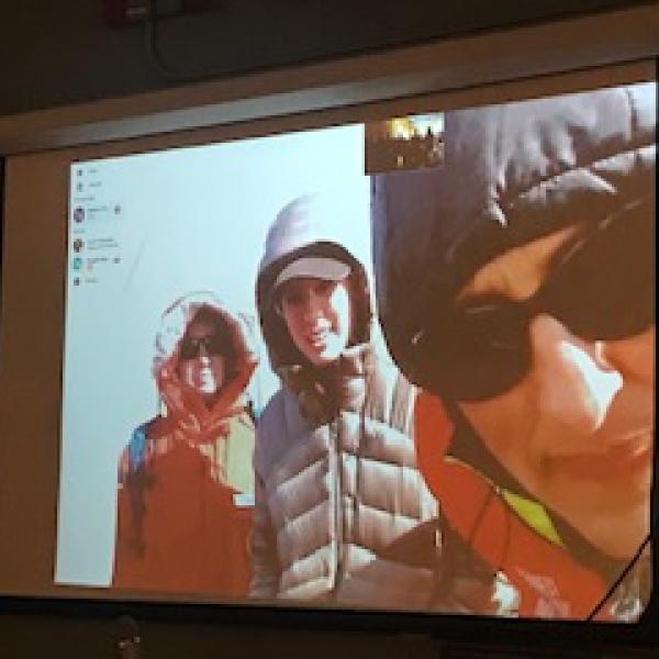 Projected image of scientists in Antarctica at a Teen Cafe in Boulder