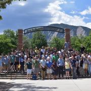 Group photo of 2023 Boulder Summer School participants in front of Farrand Field
