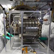Chip Bollendonk and Norm Perish work with the Interstellar Dust Experiment