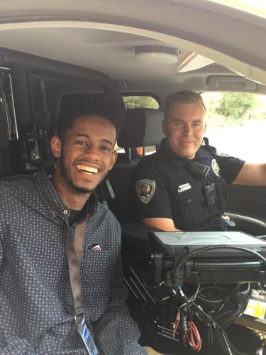 A student during a ride along with a CU Boulder officer