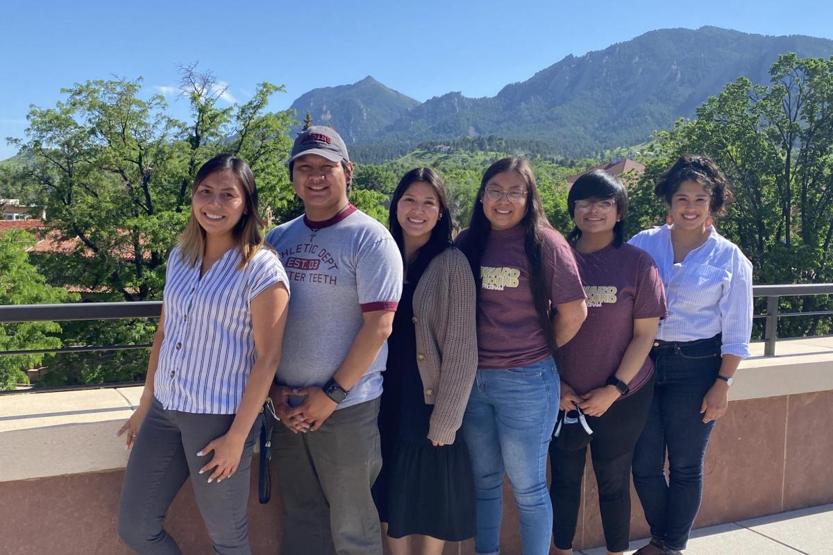 CUUB program staff posing together for a photo with the flatirons visible behind them