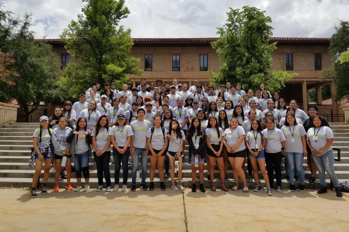 a large group of CUUB students standing on steps