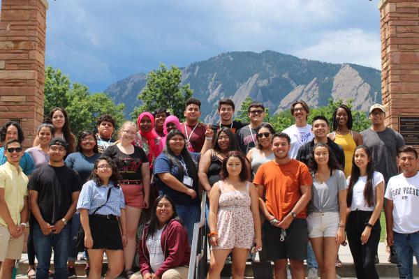 a group of students standing in front of Farrand Field