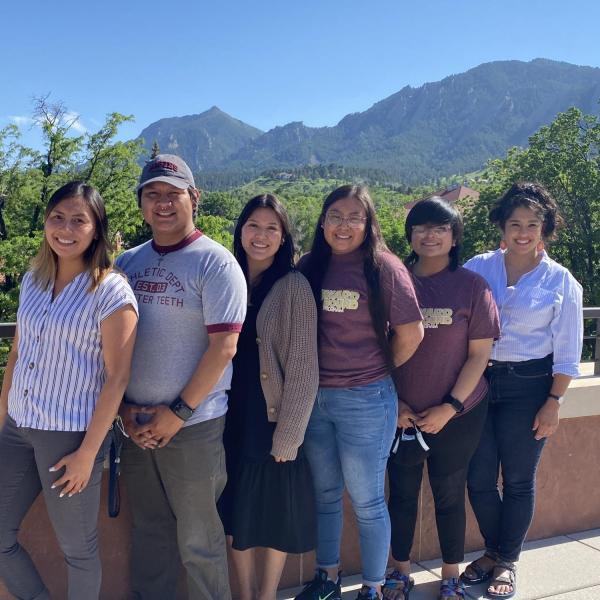 CUUB program staff posing together for a photo with the flatirons visible behind them