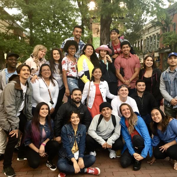 a group of students gathered together on Pearl Street Mall