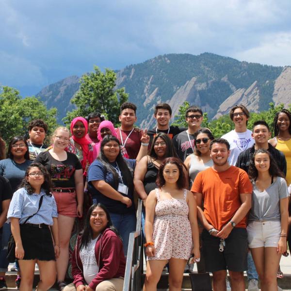 a group of students standing in front of Farrand Field