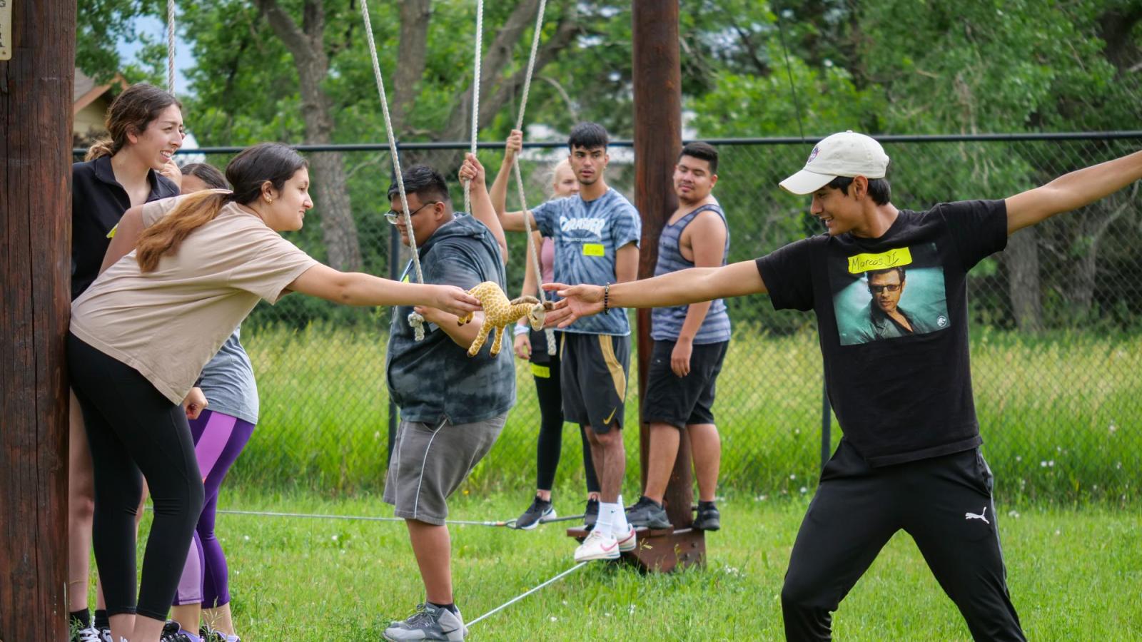 bridge students complete a ropes course together