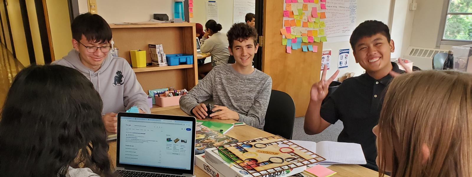A group of teens around a table