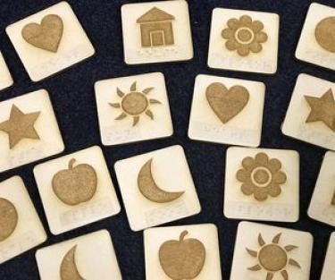 Tactile cards with embossed designs cut with a laser cutter