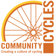 Community Cycles logo, bike wheel with adjacent text along bottom and right side of logo.