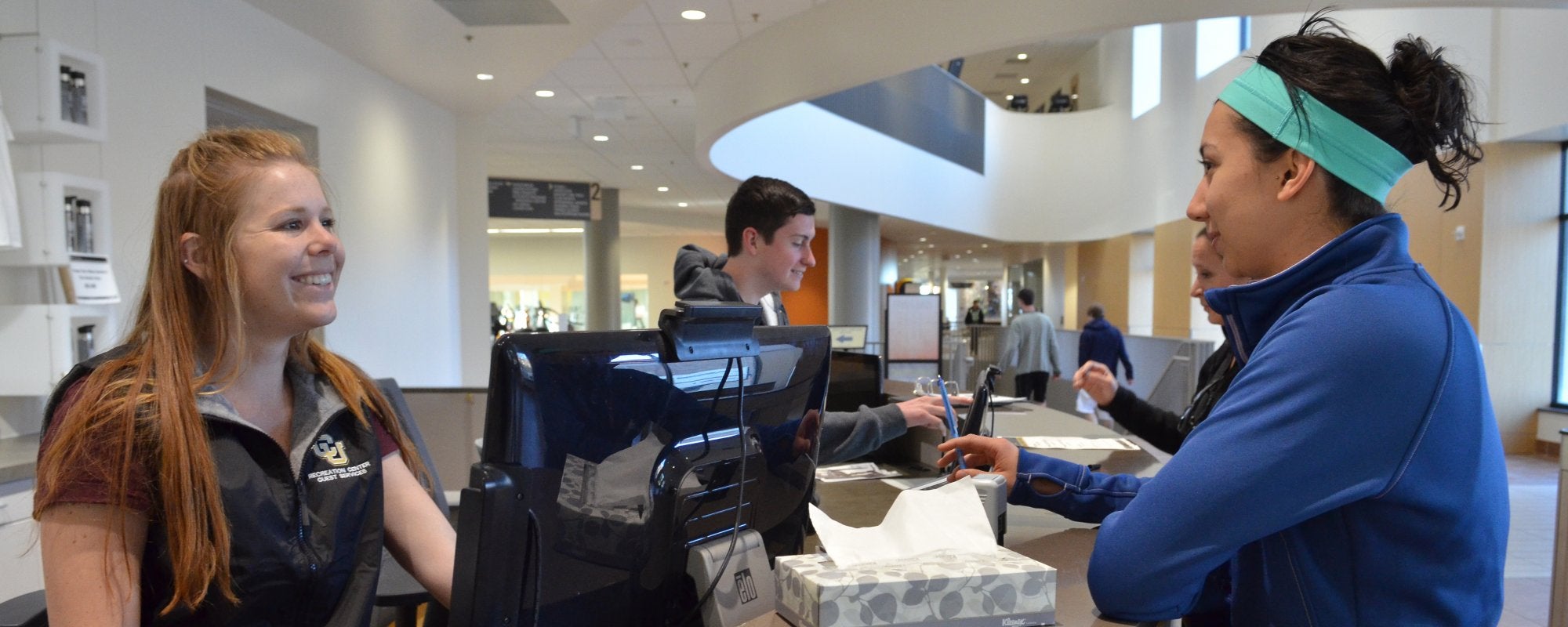 Person getting help at Guest Services desk