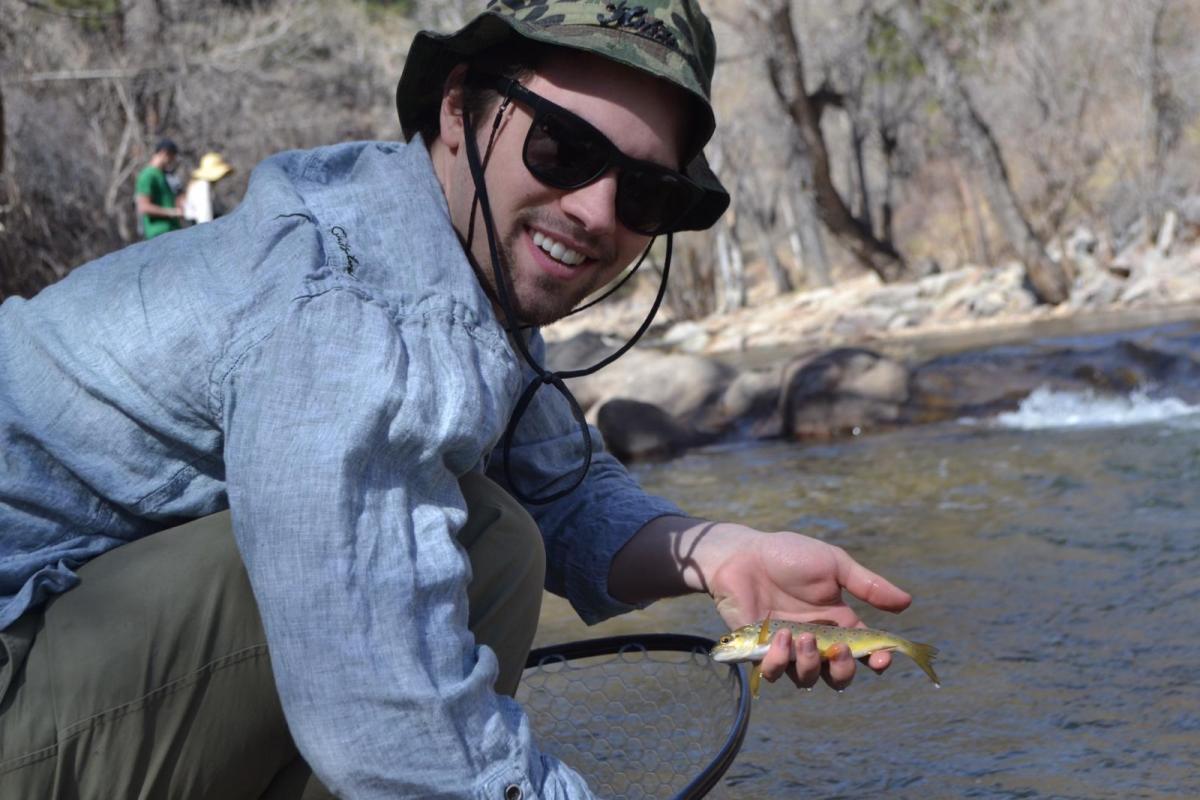 student holding fish
