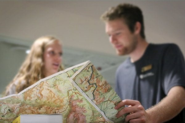 Two people looking at a map