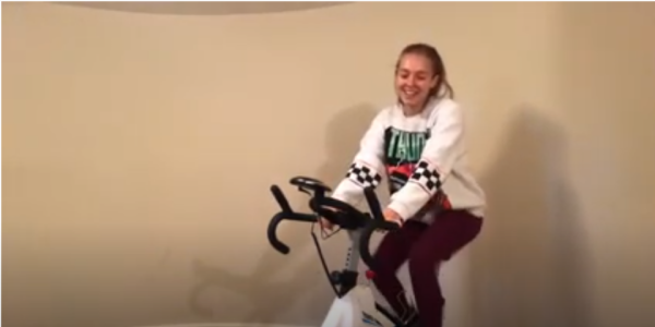 claire sitting on a stationary bike