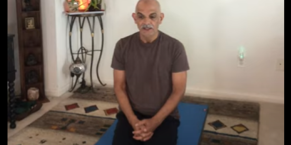 Mahmoud alone doing yoga breathing