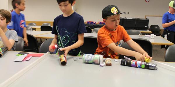 boys building lightsabers