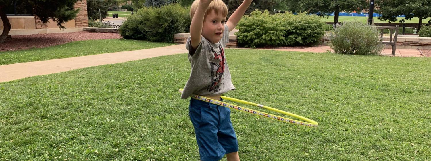 boy playing with hula hoop