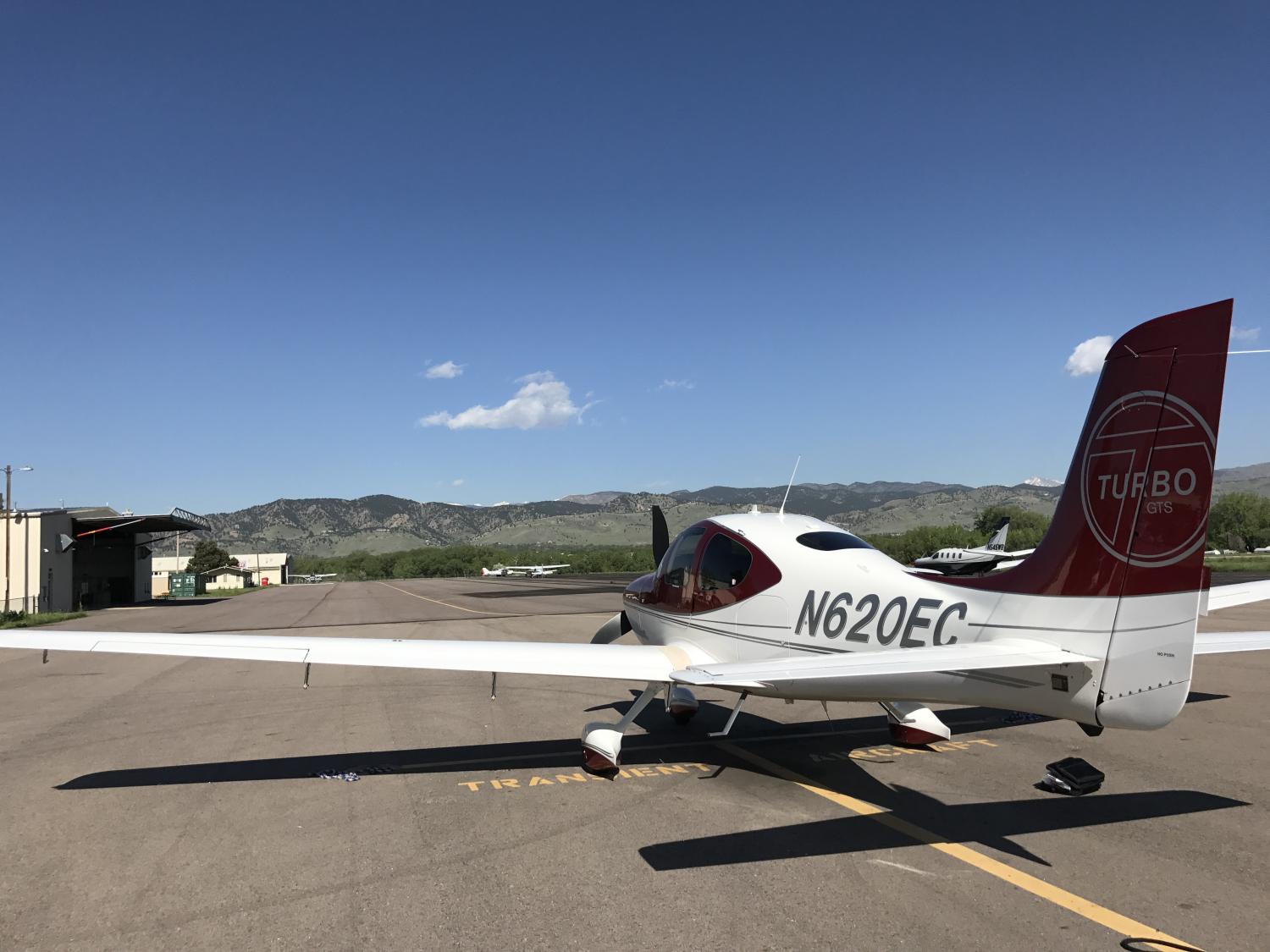 Small single-propellor plane on the tarmac of Boulder’s municipal airport