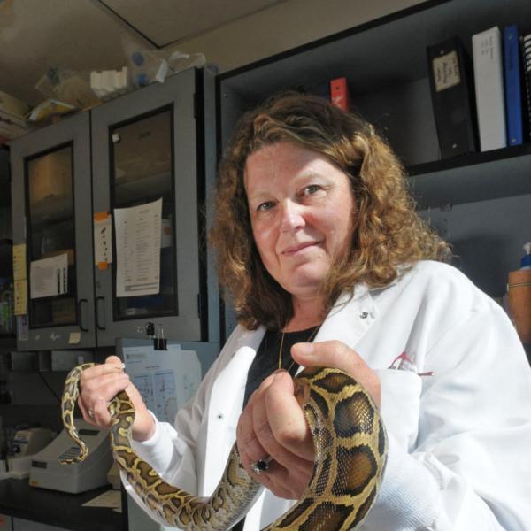 Leslie Leinward holding a snake