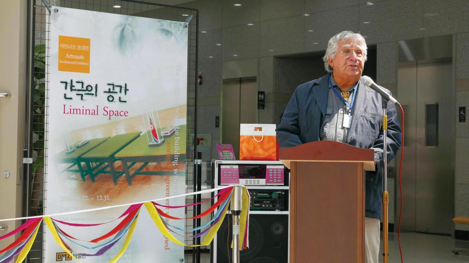 Professor at podium in South Korea