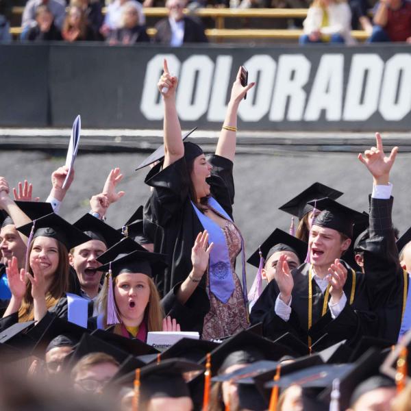 Students celebrate during a graduation ceremony