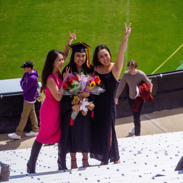 Students pose for a photo at commencement