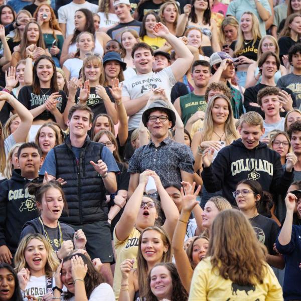 Students in Folsom Field during Kickoff