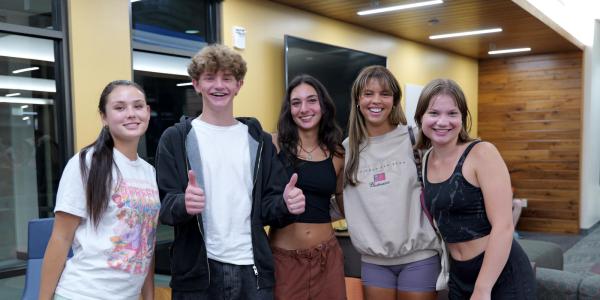 Students posing in a residential hall