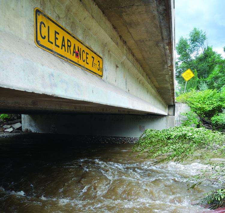 Boulder Creek overflowing its banks during the 2013 flood, under the bridge
