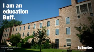 Outside of the Education Building with "I am an education Buff"