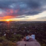 Students overlooking Boulder, enjoying the sunset