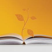 Open book and plant graphic