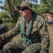 U.S. Marine Corps escorting the community on rafts