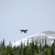 The 3DR Solo flying over the forest canopy