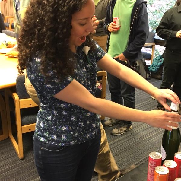 Julia popping the champagne after her exit talk, 2017